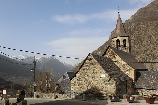 Bagergue, Spain – April 1, 2021: Sant Felix Church in Bagergue, a mountain village in Aran Valley declared one of the most beautiful villages in Spain.