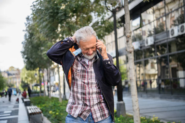 istock An Older Man is Talking in the City Streets and Having a Conversation Using his Smart Phone. 1311765608