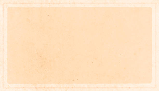 istock Pale pastel beige or fawn coloured smudged  grunge old wall textured blank empty vector backgrounds with subtle or faint border in double bold light brown lines all around 1311766461