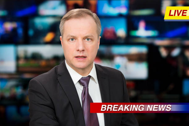 istock An anchorman reporting live breaking news 1311769155