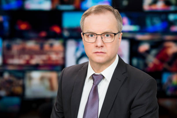 istock An anchorman reporting live breaking news 1311769251