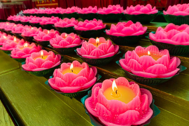 A perspective on a group of red lotus wax candle A perspective of a group of red lotus wax candle for prayers diwali photos stock pictures, royalty-free photos & images