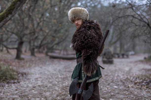 istock Russian viking warrior king in a forest 1311774584