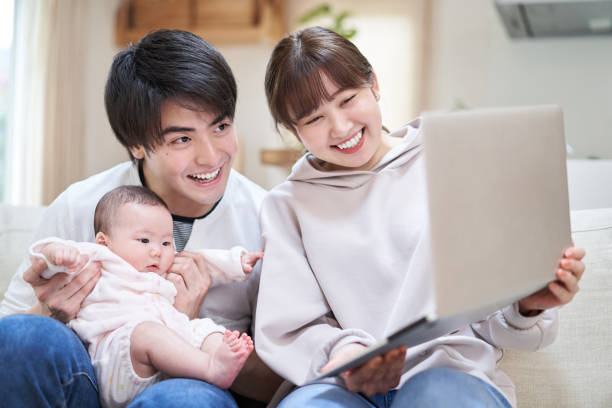 istock Asian families showing babies to relatives online 1311778833