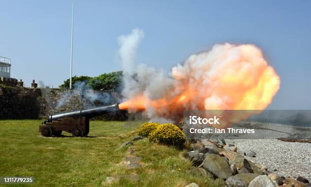 Cannon Firing And Showing The Plume Of Smoke And Fire North Wales Coast Wales Uk Stock Photo - Download Image Now