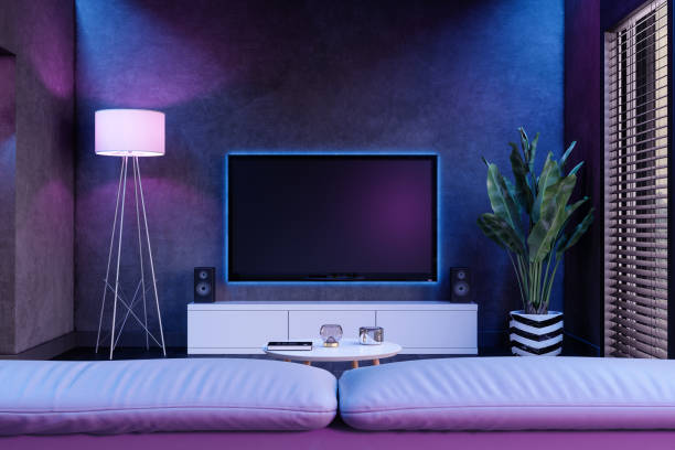 Modern Living Room And Television Set At Night With Neon Lights Modern Living Room And Television Set At Night With Neon Lights audio equipment photos stock pictures, royalty-free photos & images