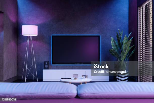 Modern Living Room And Television Set At Night With Neon Lights Stock Photo - Download Image Now