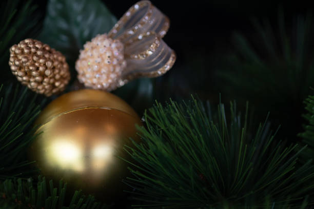 istock Christmas gold Ball on Christmas tree branch. Selective focus 1311783787