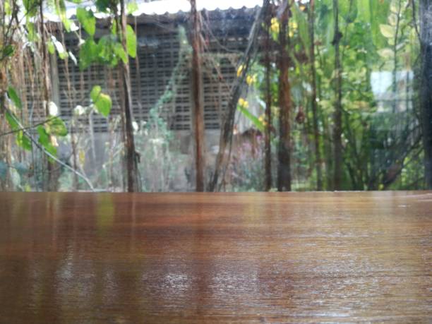 istock Wood desktop and chairs at glass window 1311786073