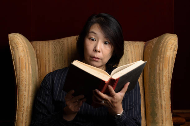 Woman reading a scary book