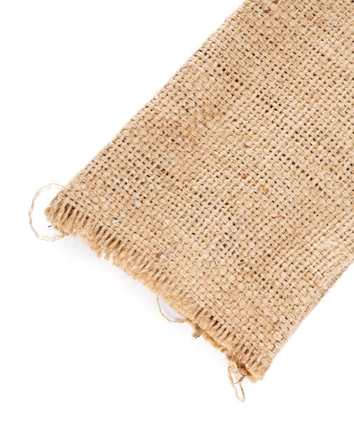 istock Brown burlap laying on white sheet. Abstract background. Texture of sackcloth. 1311790285