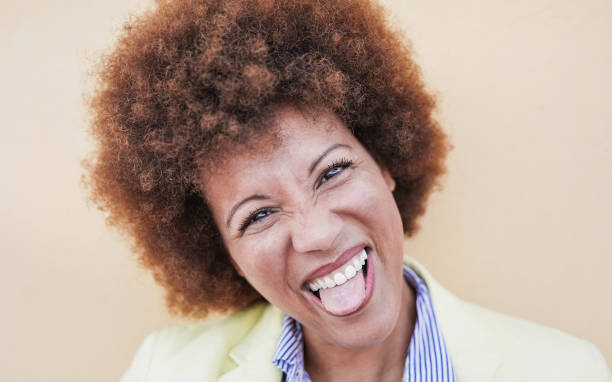 istock Crazy mature african woman looking in camera 1311793864