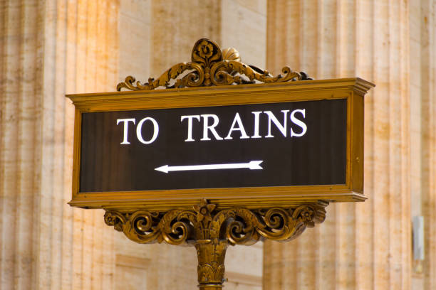 The Great Hall of Chicago's Union Station showing illuminated floor sign To Trains stock photo