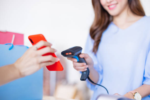 istock women pay by smartphone 1311796903