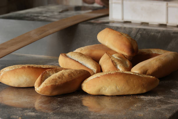 istock White freshly baked bread loaves. Fresh organic bread. 1311797644