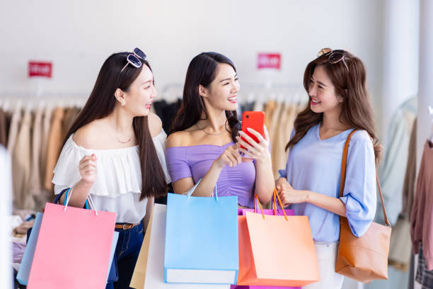 istock three women look at smartphone 1311797673
