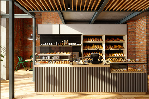 Interior de una panadería con varios panes y bollos en los estantes photo