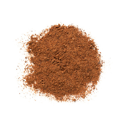 Nutmeg Powder – Heap of Raw Nutmeg Spice, Pile of Aromatic Ingredient – Top View, Close-Up Macro, from Above – Isolated on White Background