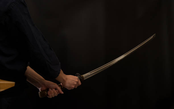 istock Portrait of the man holding katana 1311802821