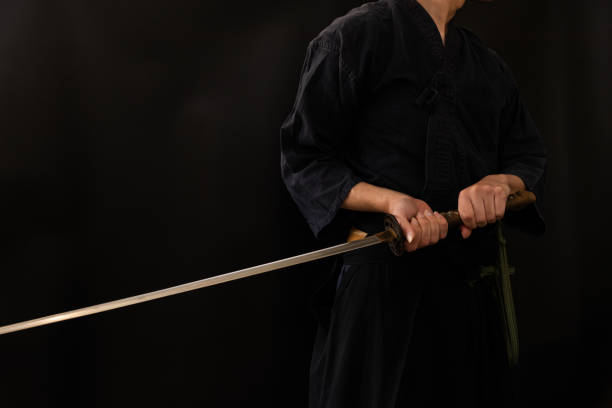istock Portrait of the man holding katana 1311802875