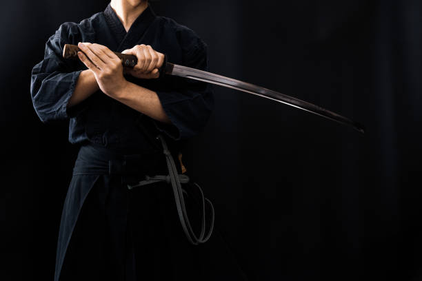 istock Portrait of the man holding katana 1311802909
