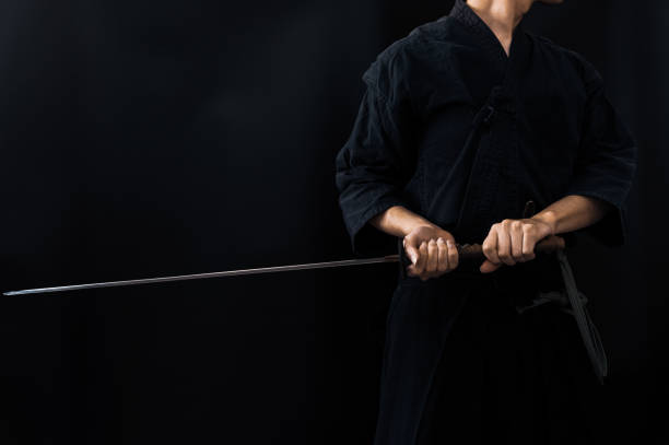 istock Portrait of the man holding katana 1311802952