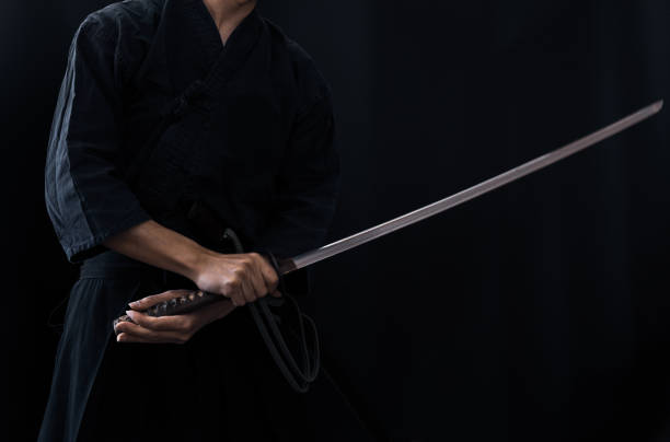 istock Portrait of the man holding katana 1311802992