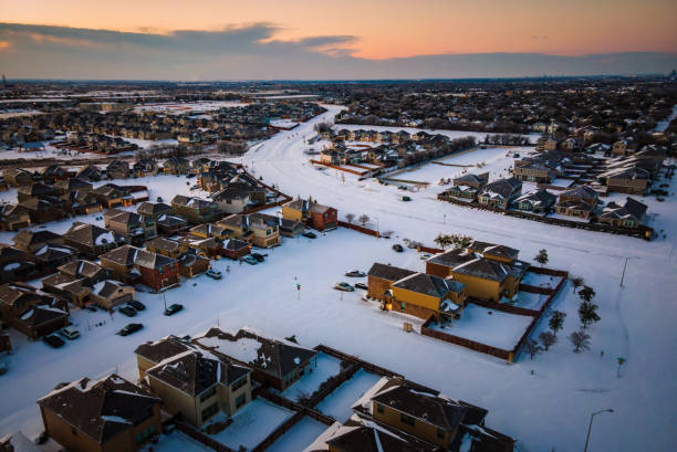 istock Sunrise over Suburb Homes with Winter Snow 1311802993