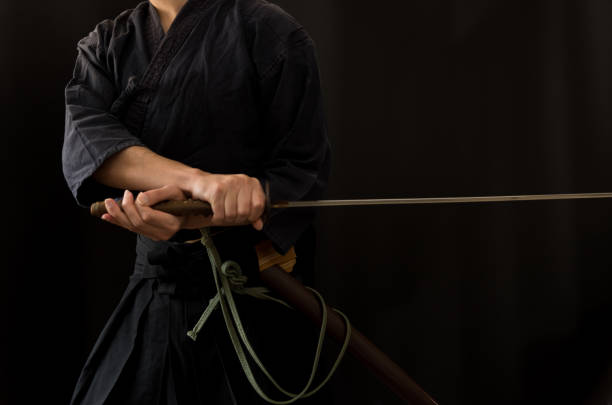 istock Portrait of the man holding katana 1311803097