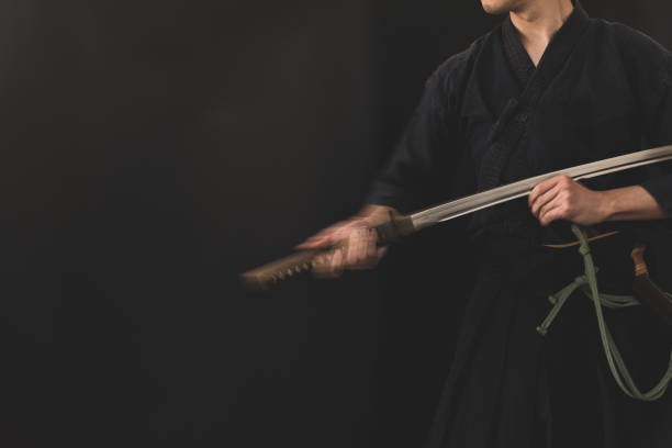 istock Portrait of the man holding katana 1311803386