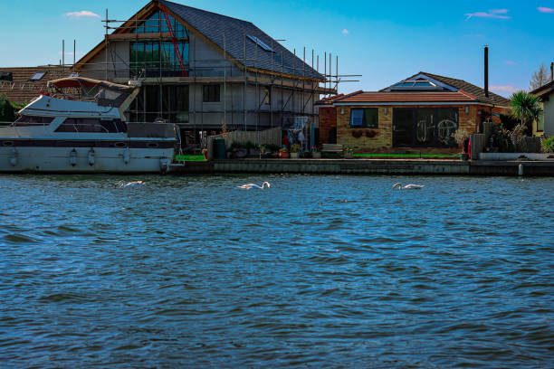 istock Yacht and Riverfront property on the thames under development 1311804569