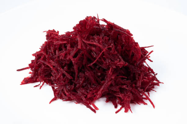 istock Small portion of grated raw beets heaped on white background 1311808927