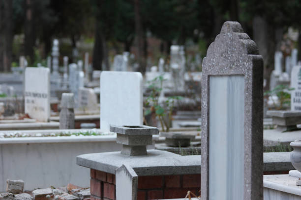 Headstone at Muslim cemetery. Blurred graveyard background. Turkey, Europe.