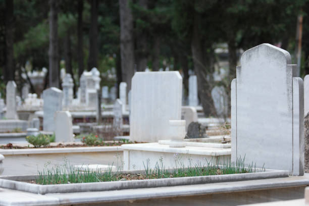 istock Grave with headstone at Muslim cemetery. Graves background. 1311809176