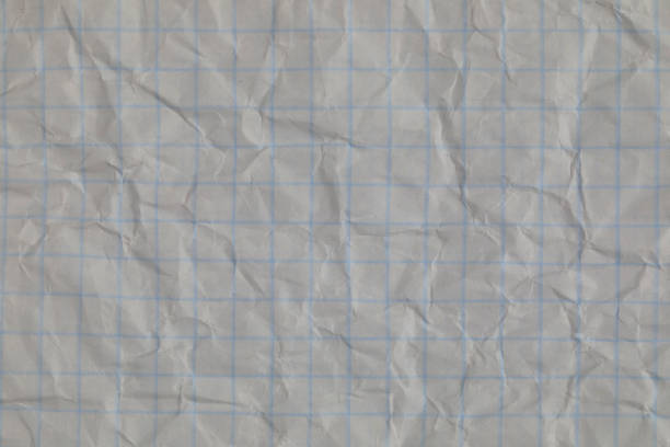 istock Crumpled checkered sheet of paper 1311809410