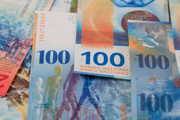 istock New and previous issue of the Swiss franc 1311809476