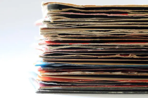 Group of old vinyl singles in original sleeves, 7 inches records covers.