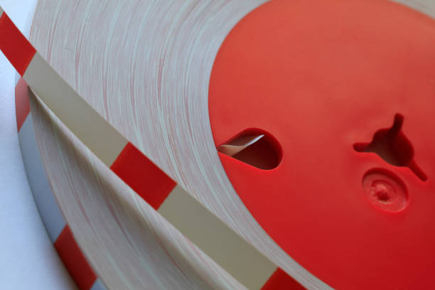 istock Leader-tape reel, white-red 1311810611