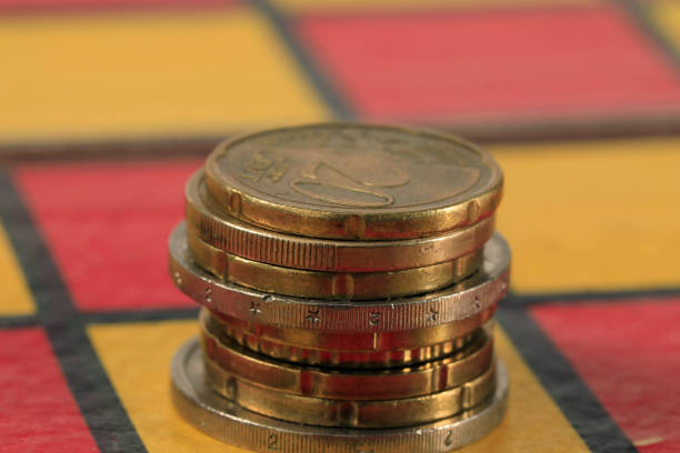 istock Several EUR coins lie on the chessboard 1311810807
