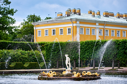 Peterhof, Russia - May 29, 2021: The Marly Palace on the shore of the Marlin Pond.