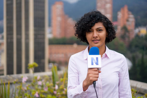 Tv reporter outdoors reporting breaking news