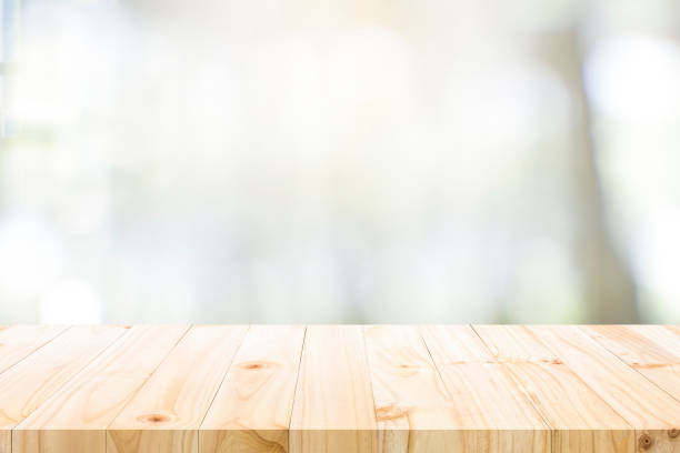 istock Empty wooden table for present product on coffee shop blur background. 1311820101