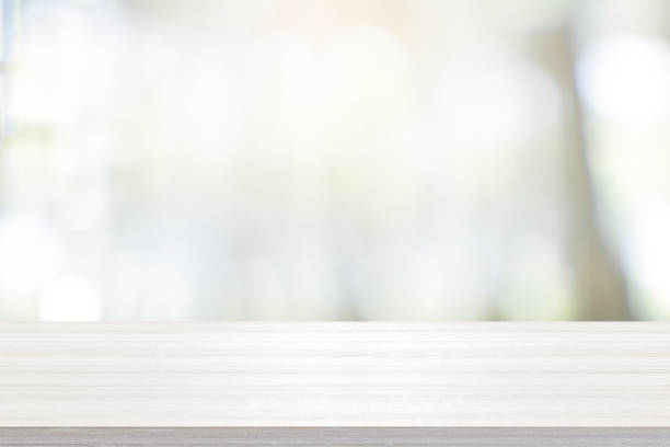 istock Empty wooden table for present product on coffee shop blur background. 1311820112
