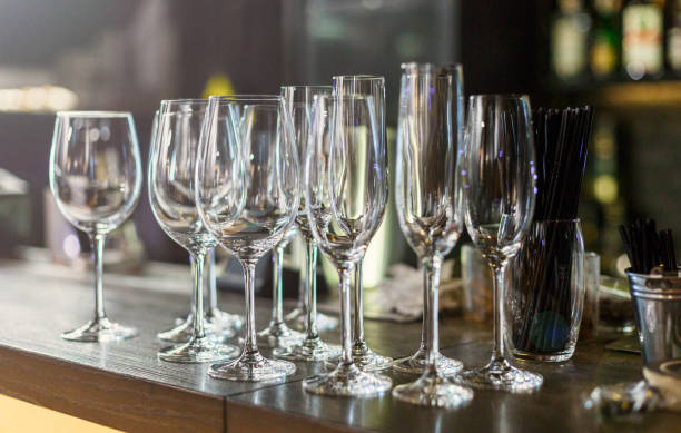 istock Empty white wine glasses on the table in the restaurant or bar. Table setting, close up. Glasses for alcohol. 1311827352