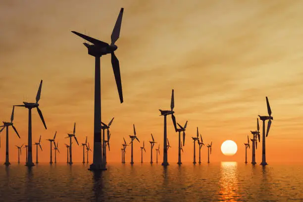 Photo of Offshore Wind Turbines At Sunset
