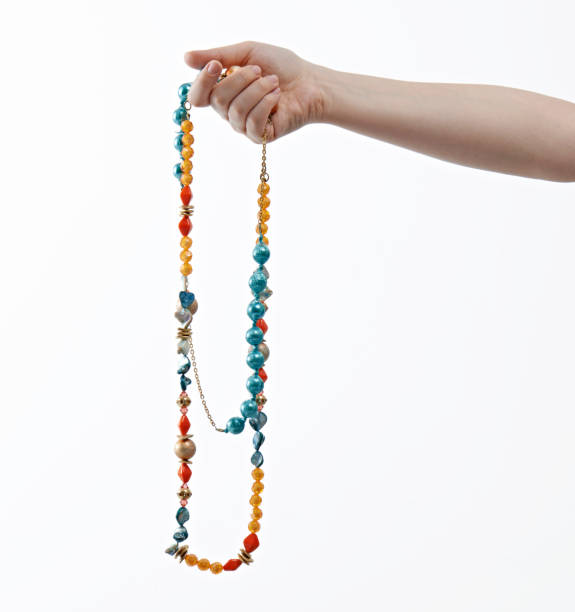 Woman holding a necklace