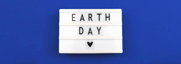 istock Celebration banner for Earth Day 22th april, blue background, lightbox with lettering 1311832595