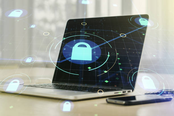 istock Double exposure of creative lock hologram with chip on laptop background. Information security concept 1311832695