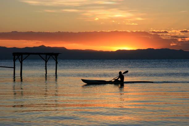 Beautiful sunset with traditional kayak on Lake Malawi stock photo