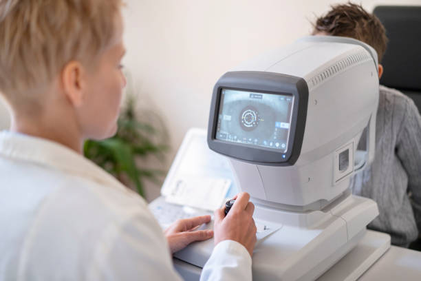 istock A boy taking an eye test in a very modern clinic 1311834829
